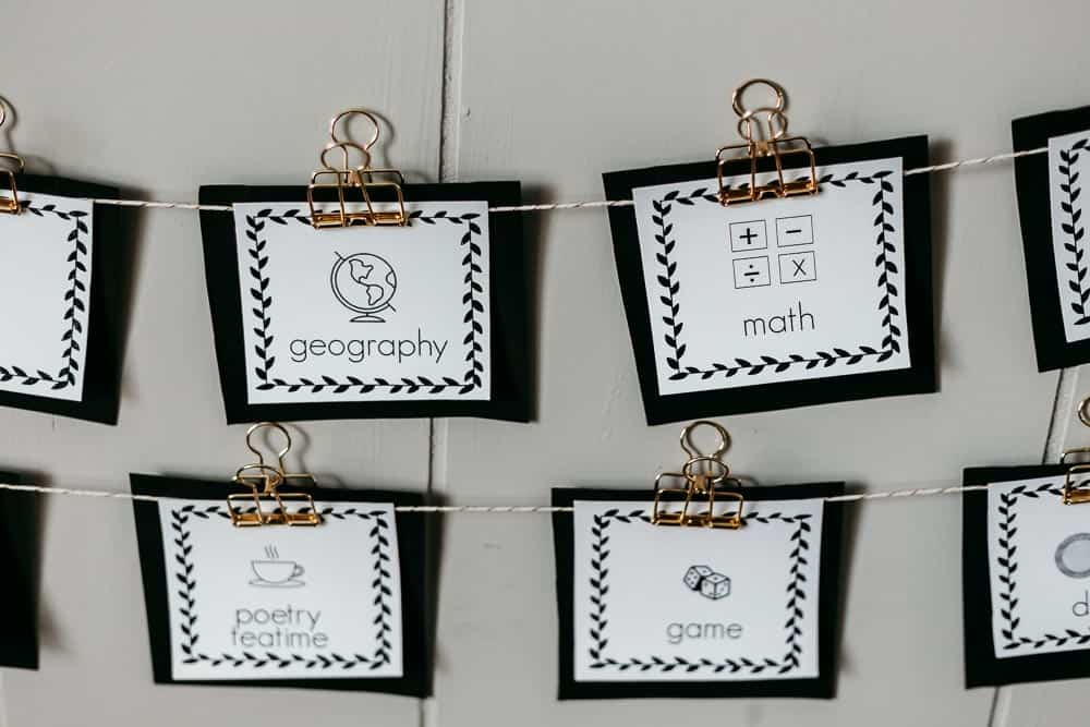 visual homeschool schedule cards displayed by hanging with clips.