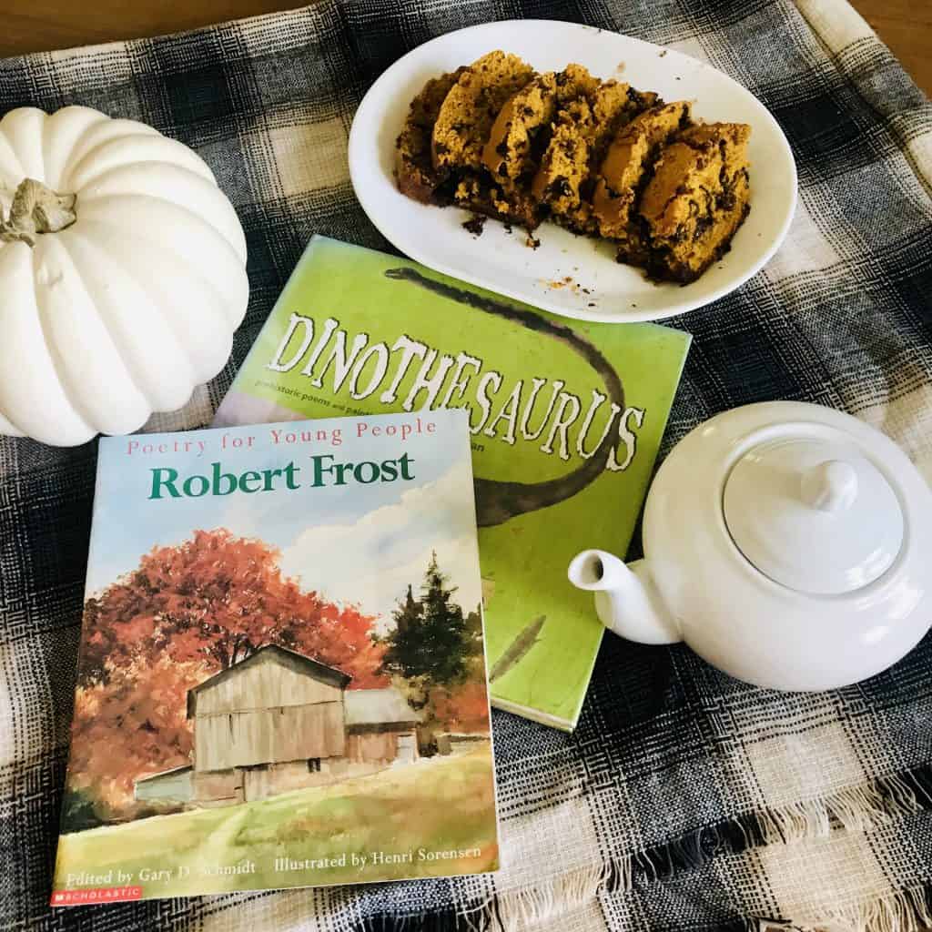 fall poetry teatime with white pumpkin, tea pot, chocolate chip pumpkin bread, Robert Frost poetry book and Dinothesaurus poetry book.