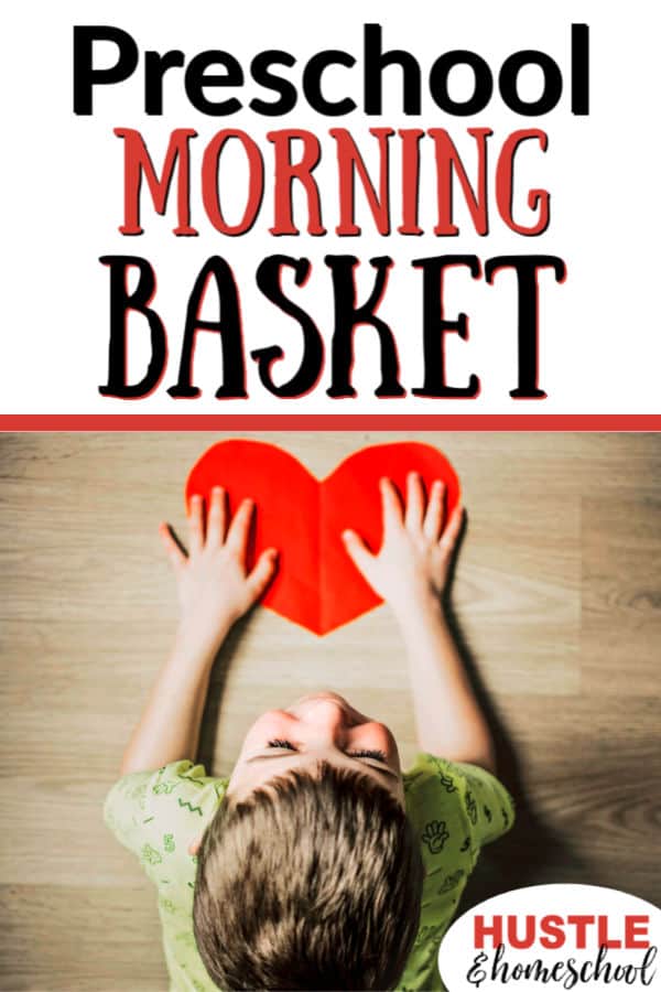 Preschool Morning Basket Time, boy laying on floor with paper heart